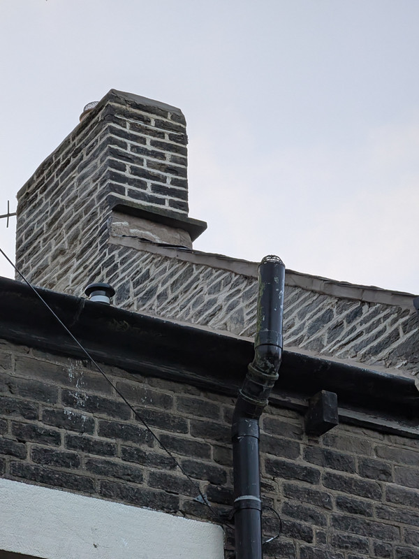 Stone chimney stack after repointing