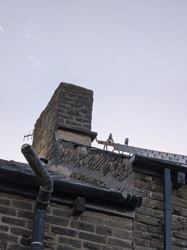 Stone chimney stack before repointing
